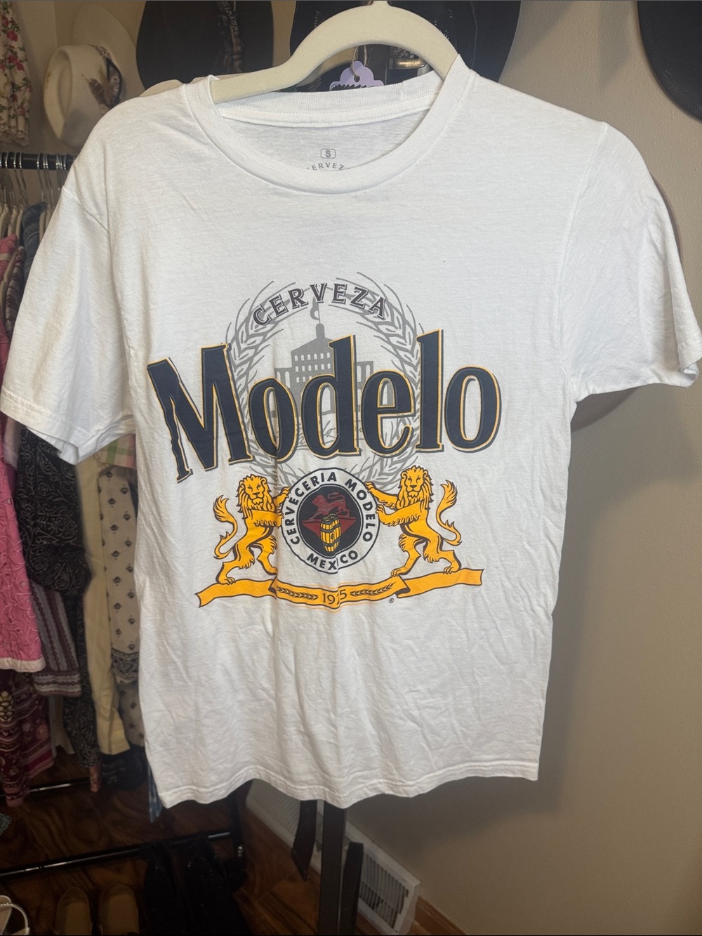 Ripple Junction White Modelo Graphic Tee with Gold and Black Logo